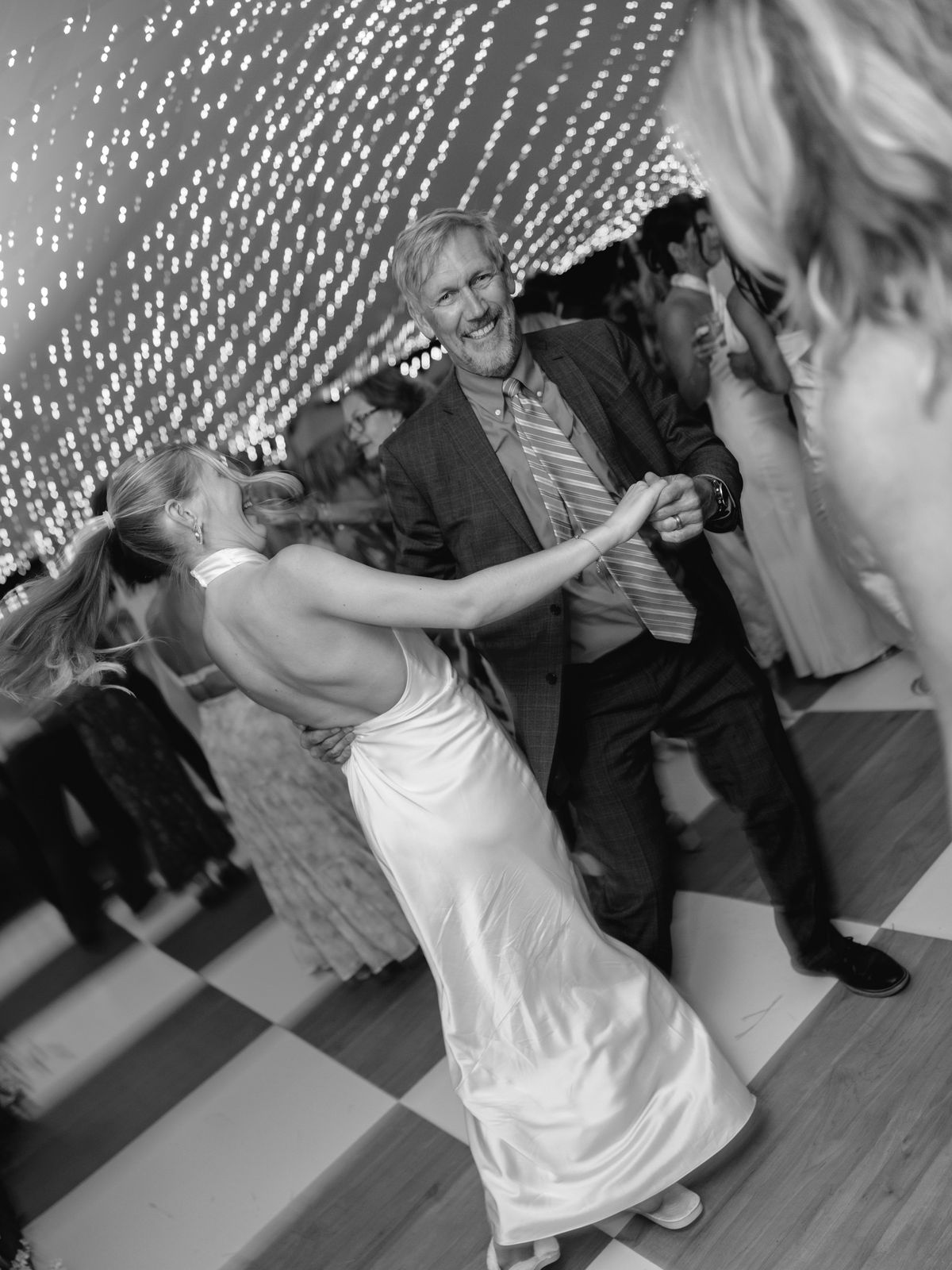 Father-daughter dance on the checkered floor