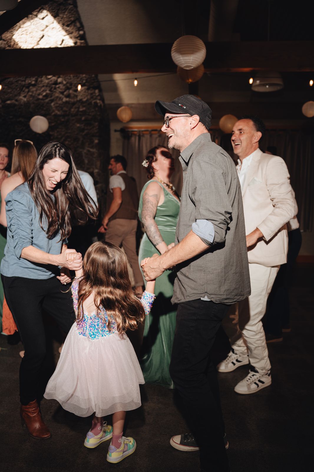 Parents dancing with their little girl