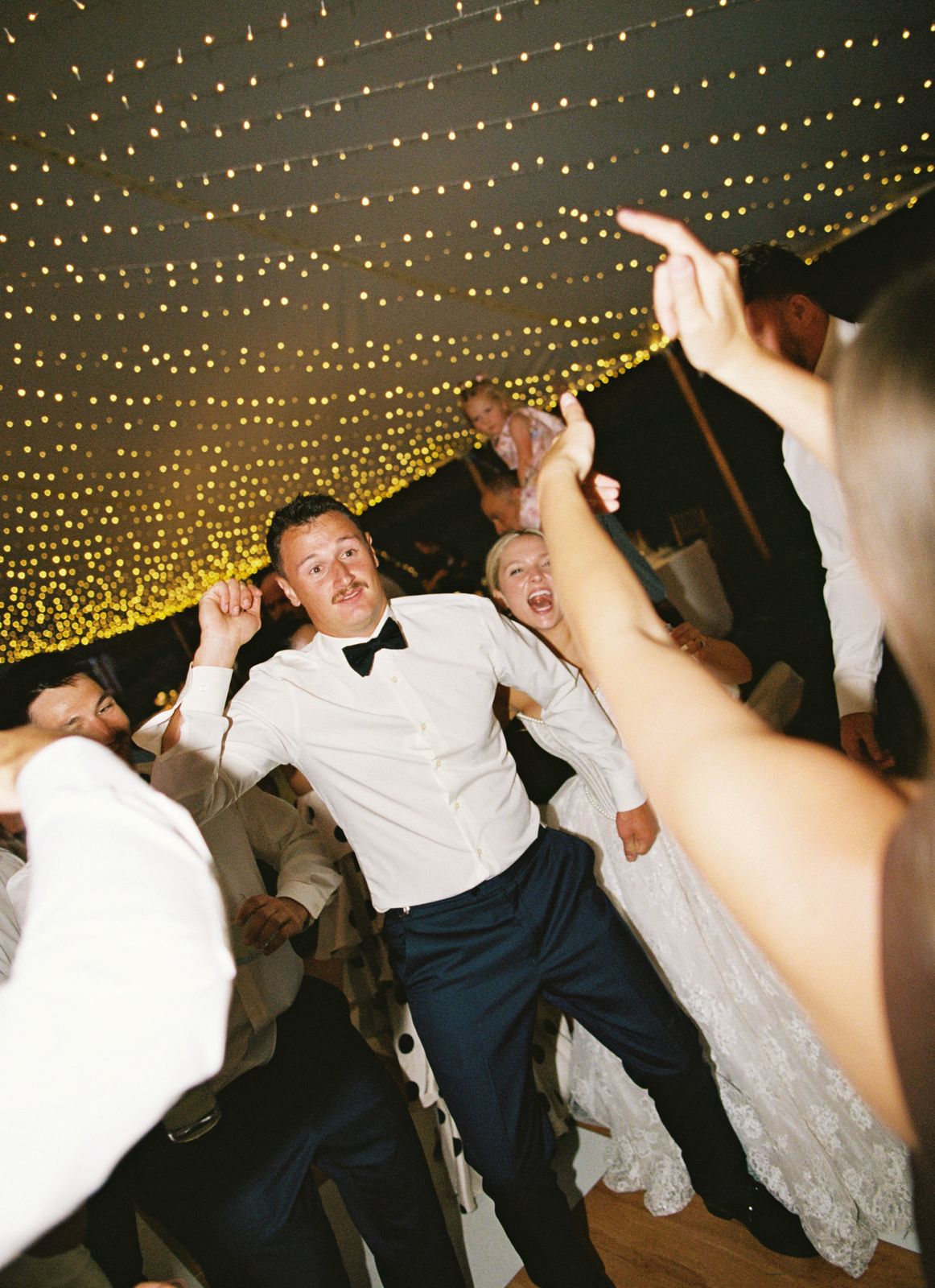 Groom in the middle of a packed floor