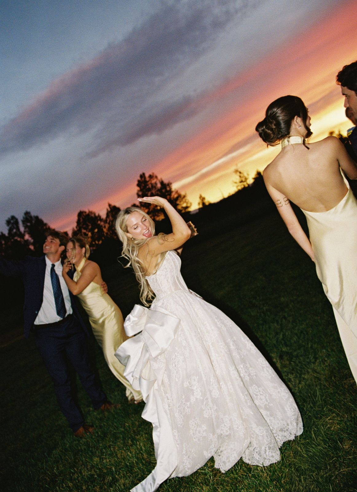 Bride dancing at sunset