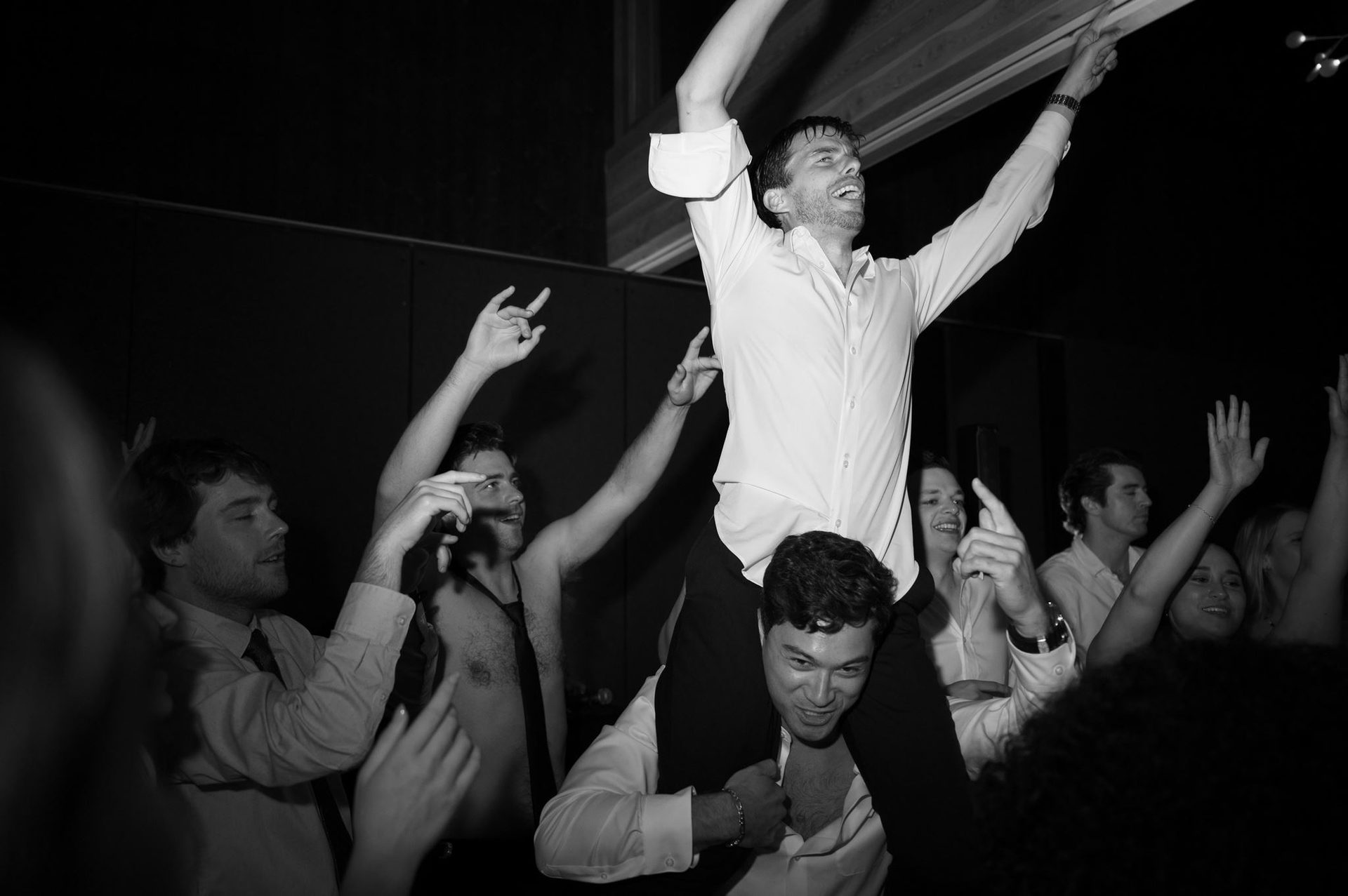 Groom on shoulders as the floor goes off