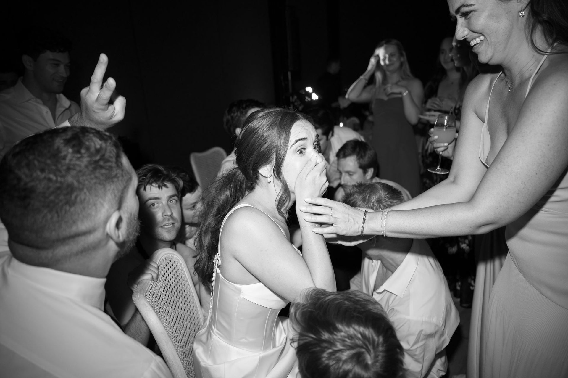 Bride catching a moment in the middle of the party