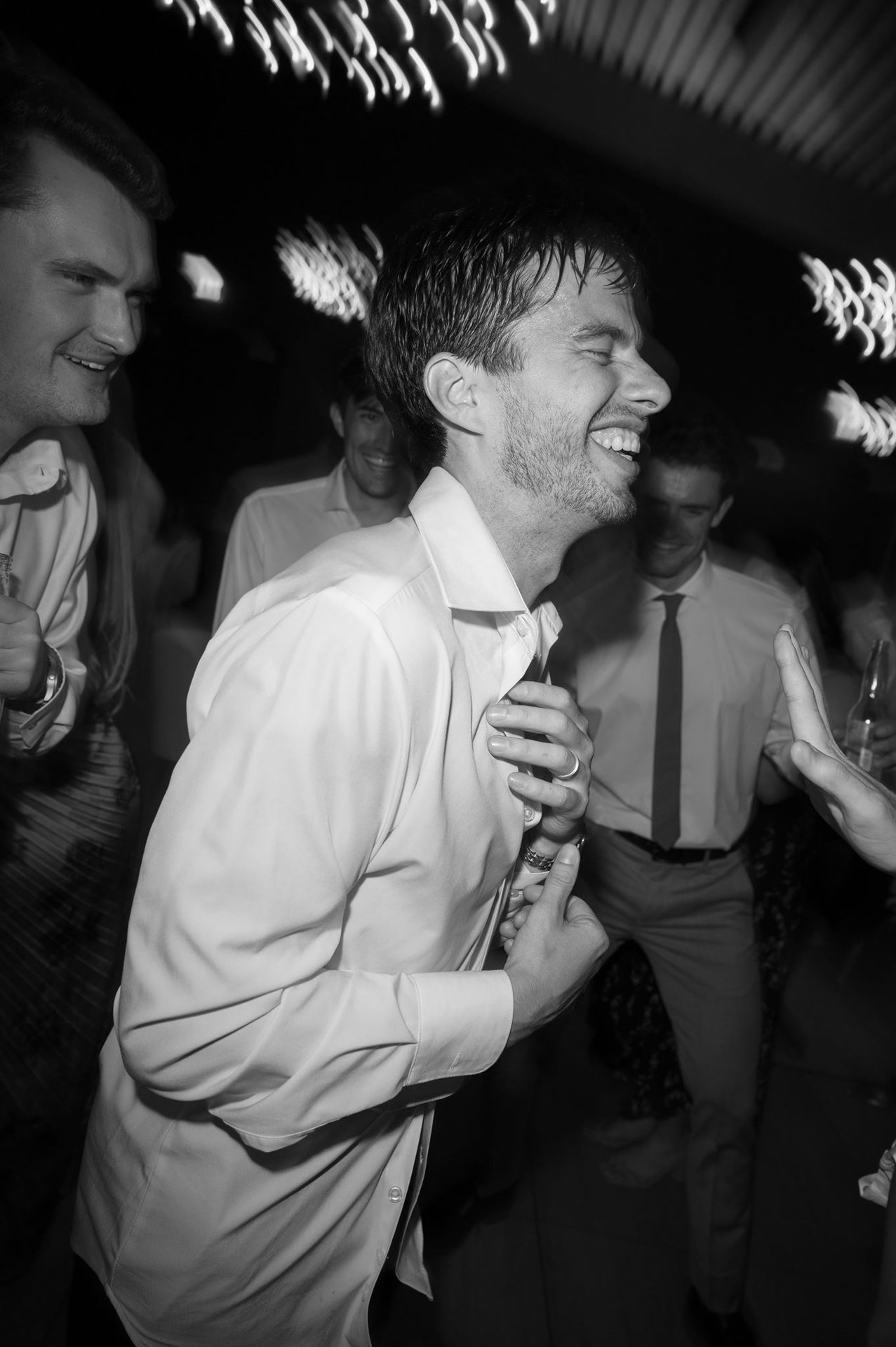 Groom laughing through the peak